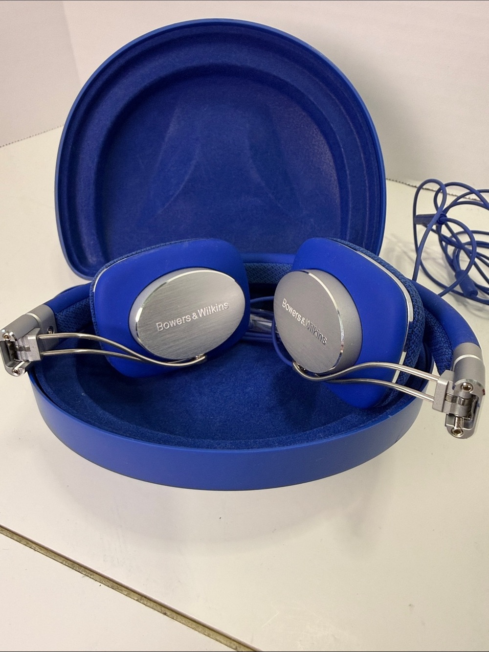 Bowers & Wilkins Blue On‑Ear Headphones with Silver Accents (damaged case)